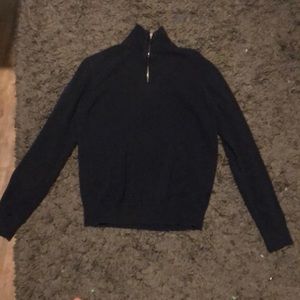 A nice dark blue sweater that is zip up